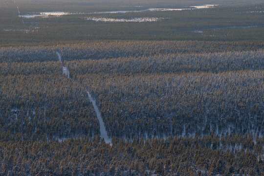 Hiking to the summit of Mount Kiilop&auml;&auml; during a spectacular arctic sunset in Finnish Lapland.