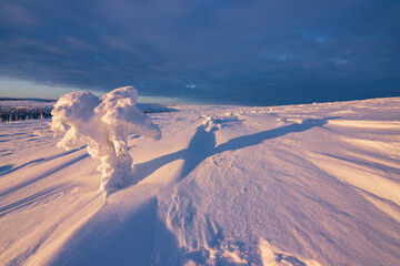 Hiking to the summit of Mount Kiilopää during a spectacular arctic sunset in Finnish Lapland. © julen