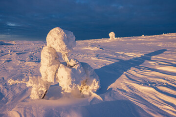 Hiking to the summit of Mount Kiilopää during a spectacular arctic sunset in Finnish Lapland. © julen