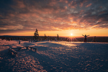Hiking to the summit of Mount Kiilopää during a spectacular arctic sunset in Finnish Lapland. © julen