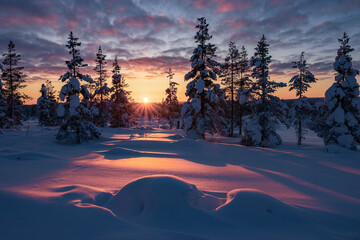 Hiking to the summit of Mount Kiilopää during a spectacular arctic sunset in Finnish Lapland. © julen