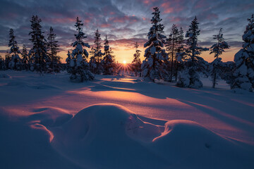 Hiking to the summit of Mount Kiilopää during a spectacular arctic sunset in Finnish Lapland. © julen