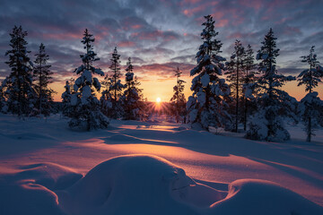 Hiking to the summit of Mount Kiilopää during a spectacular arctic sunset in Finnish Lapland. © julen