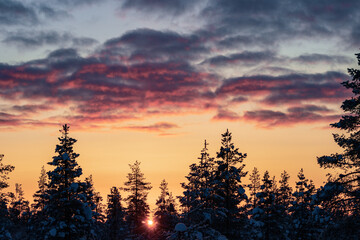 Hiking to the summit of Mount Kiilopää during a spectacular arctic sunset in Finnish Lapland. © julen