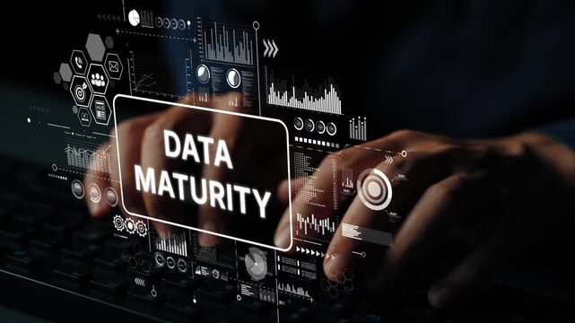 Hands Typing on Keyboard with Data Maturity Concept and Digital Analytics Graphics in Background. Asymptotic smart data analytic.