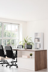 Fototapeta premium Interior of conference hall with desk, shelf unit and palm plant