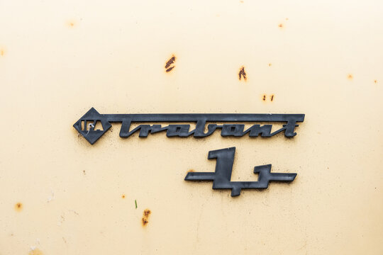 LINTHE, GERMANY - JUNE 08, 2025: Close-up of the vintage Trabant logo on a rusty weathered car body. Die oldtimer show.