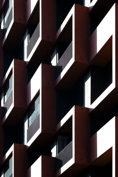 Abstract architecture detail of modern building facade where windows drive contrast pattern and urban geometry repetition with bold rhythm
