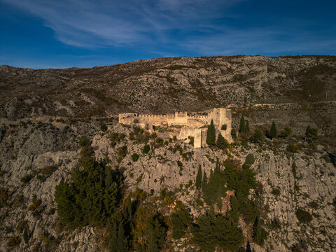 Blagaj Teke dervish monastery and medieval stone fortress castle aerial drone panorama view in Bosnia.
