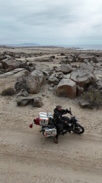 4K Drone active track: Motorcycle riding through Zoologico de Piedra granite formations in Caldera. Adventure biking in Atacama.