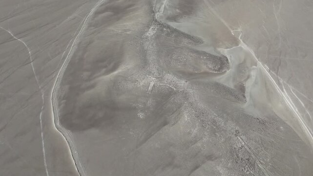 4K aerial cinematic shot of Atacama Giant geoglyph on Cerro Unitas. Ancient archaeological anthropomorphic figure in Chile.