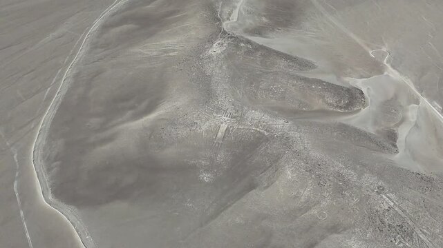 4K aerial cinematic shot of Atacama Giant geoglyph on Cerro Unitas. Ancient archaeological anthropomorphic figure in Chile.