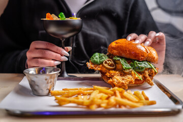 Crispy Chicken Burger With Fries And Cocktail