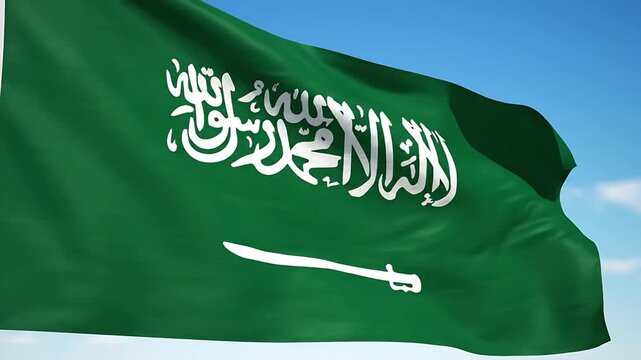 The waving Saudi Arabian flag, showcasing the emblem with a sword and Arabic script against a clear sky. The flag's green color symbolizes Islam. 