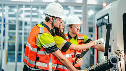 A team of engineers uses an AI-driven smart factory for advanced manufacturing. This future of work...