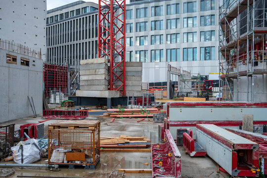 Urban development industry at a construction site with crane building equipment and materials showing infrastructure growth and active work progress