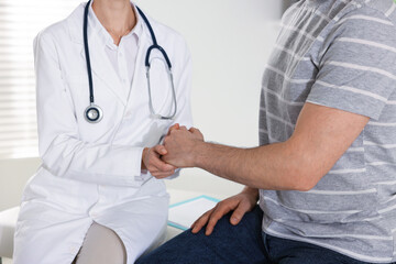 Man having appointment with doctor in clinic, closeup