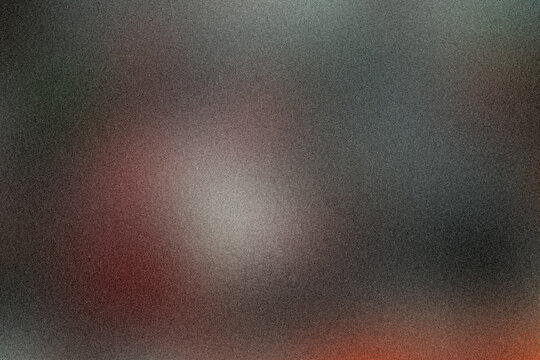 Deep gray and muted red hues dissolve into a soft blur, creating a moody, atmospheric abstract background suited for cinematic designs and bold branding concepts.