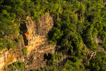 Stunning cliff formation in a lush green valley in Sao Paulo state. A landmark representing the region unique geology, farm pastures and the beauty of the Atlantic Forest biome © AlfRibeiro