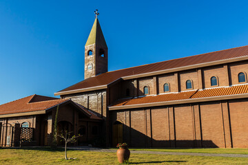 Facade of the church built with bricks in view of the Divina Misericordia Monastery, in rural area of ​​the Marilia, Sao Paulo state, Brazil