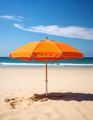 Bright orange beach umbrella against a blue sky, sandy beach, ocean backdrop