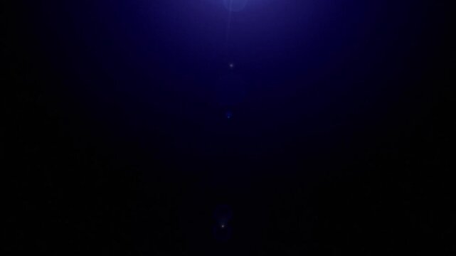 HD beautiful blue abstract lens flare on a black background