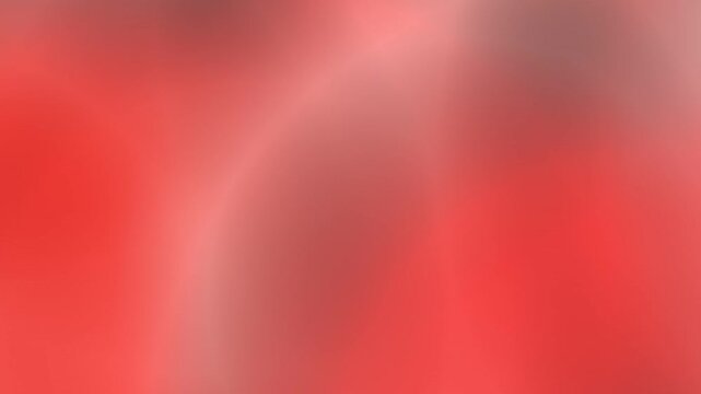 A soft, abstract gradient background with warm, vibrant red and pink tones blending seamlessly for a visually appealing and versatile design element