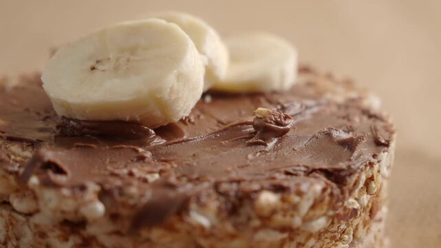 Chocolate spread with banana on oat cake preparation