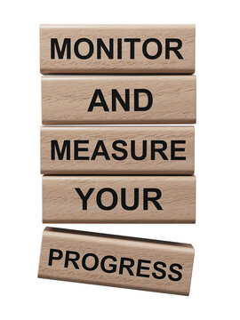 Monitor and Measure your Progress symbol. wooden blocks with words Monitor and Measure your Progress.Businessconcept.Supports PNG files with transparent backgrounds.