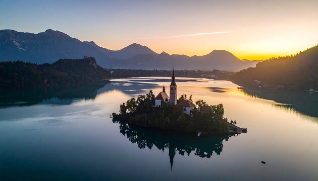 Aerial view of a serene lake with a small island church