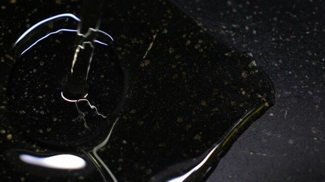 Kitchen close-up of oil poured before cooking