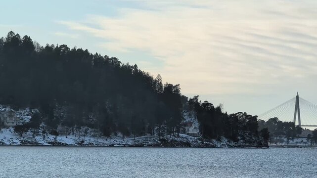 A video of Uddevallabron were the E6 highway is. in winter shot from skeppsviken. Shot in 60fps. this clip is 23,976 slowmotion so you can decide how you want it.