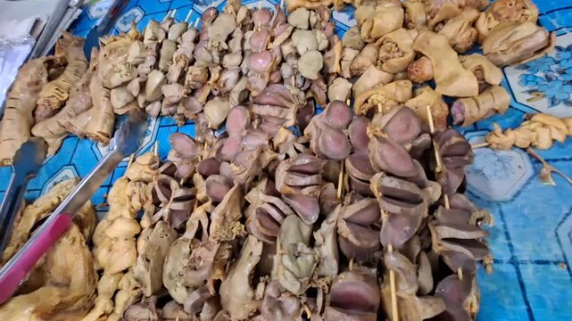 chicken skin satay, chicken gizzards, chicken skeletons, poultry pieces at street vendors
