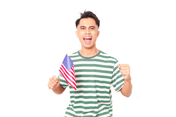 Fototapeta premium An excited man holding the American flag outdoors to celebrate national holiday, expressing pride, freedom, and success with a joyful smile.
