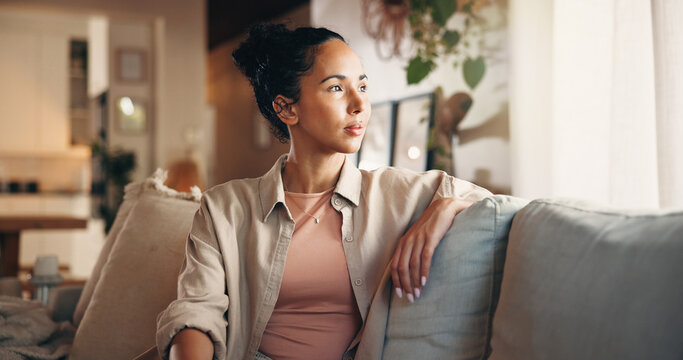 Relax, thinking and vision with woman on sofa in living room of home for break, chilling or me time. Memories, nostalgia and reflection with thoughtful person in apartment for weekend planning
