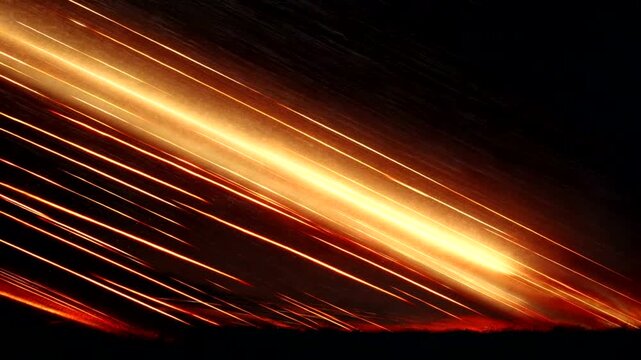 Dynamic streaks of light across a dark sky at night