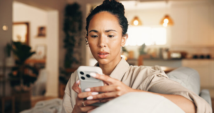 Worry, woman and reading with phone at house for scam, phishing email and fraud notification. Concern, female person and mobile for fake news, suspicious payment and virus warning with hacking threat