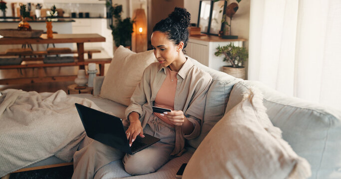 Laptop, payment and woman on sofa with credit card, online utility bills or fintech for eft transaction. Person, typing and computer in home with digital banking, household expenses or insurance fee.