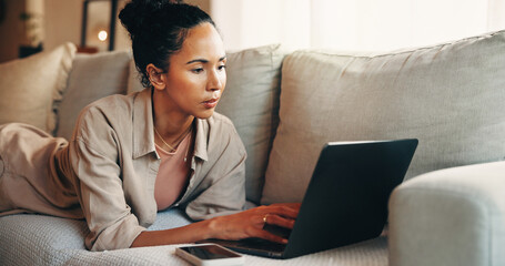 Remote work, review or woman on sofa with laptop, draft edit or source feedback for article. WFH,...