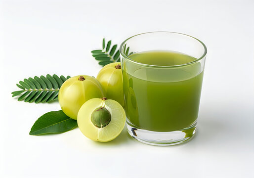 A glass of amla juice with fresh amla fruits and leaves on white background