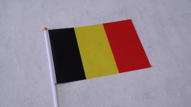 Belgium flag close up on white background. Belgian national flag.