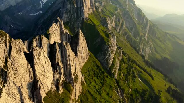 Majestic mountain landscape with rocky cliffs and green valleys