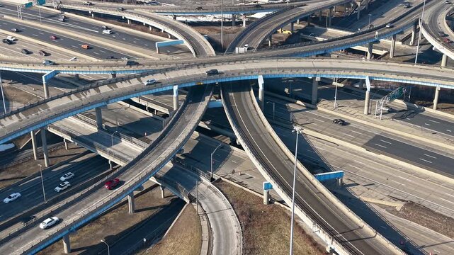 Aerial view of cars driving on a complex highway interchange in Detroit, Michigan.
