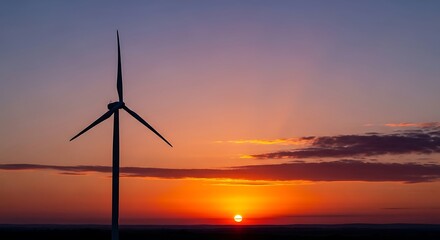A serene sunset scene with a wind turbine