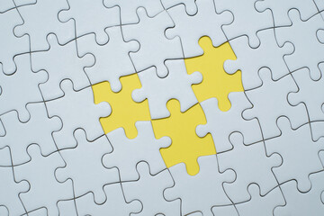 Fototapeta premium Missing puzzle piece on coloured background. Completion, solution, problem solving and teamwork concept