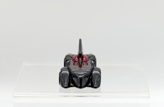 Bologna - Italy - February 10, 2026: Batmobile from Batman the brave and the bold die-cast model by Hot Wheels isolated on white background. Front view.