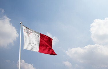Malta national flag waving in sky.