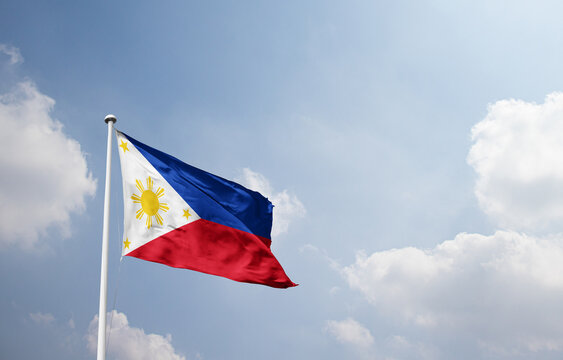Philippines national flag waving in sky.