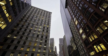 historic masonry meets modern glass towers creating contrast between ornate brick facades, cornices and sleek reflective surfaces in vibrant downtown © icetray