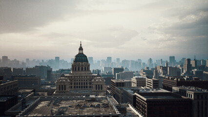 Fototapeta premium sunlit city skyline framing historic capitol, editorial sunrise shoot for travel magazine, drone survey for realestate mapping, morning commute routes visible,